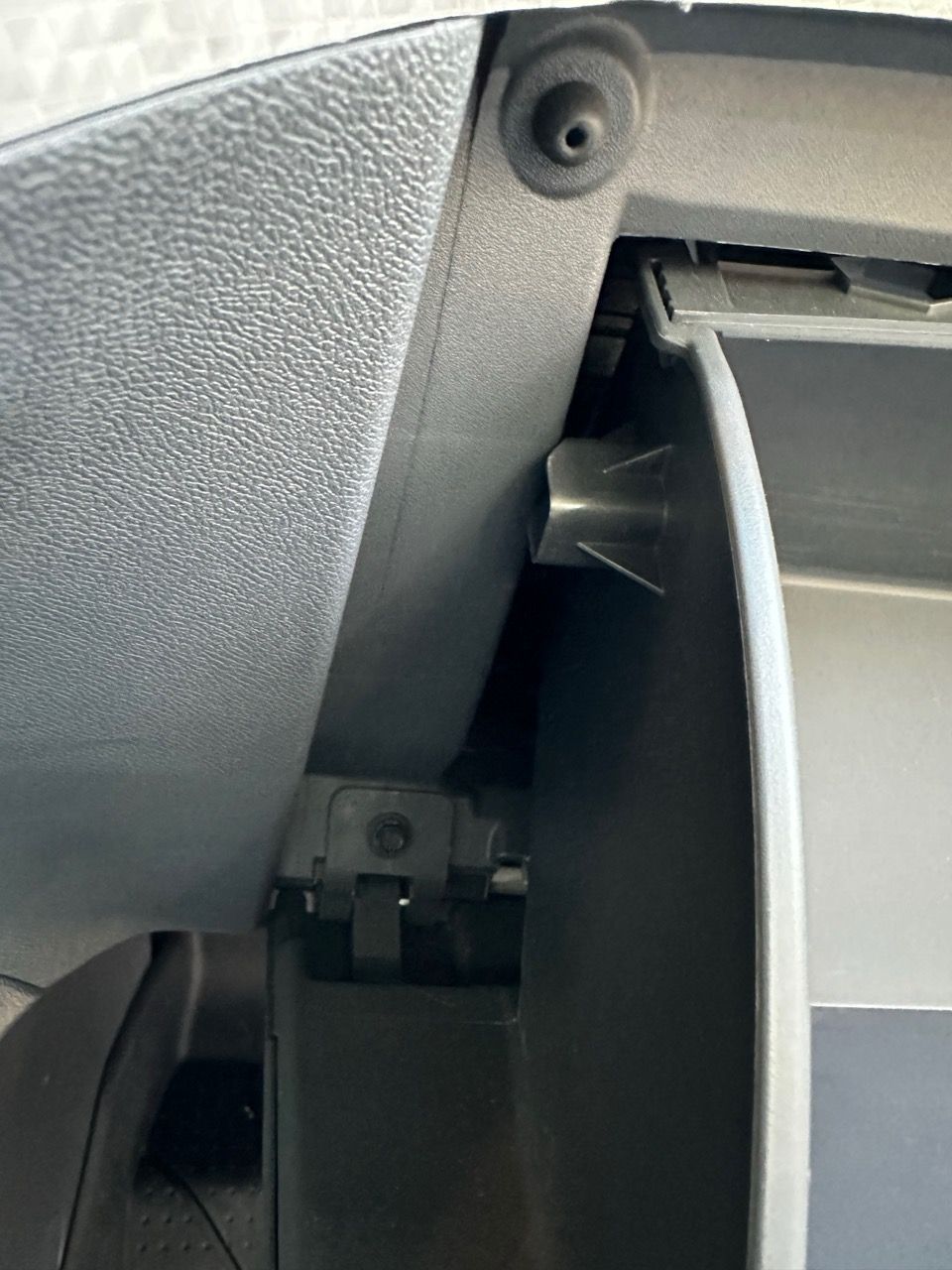 The glove box catch/stopper.